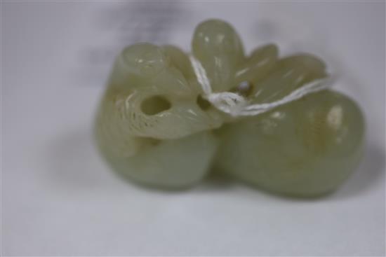 A Chinese pale celadon jade carving of two ducks biting lotus, 19th century L. 5.3cm